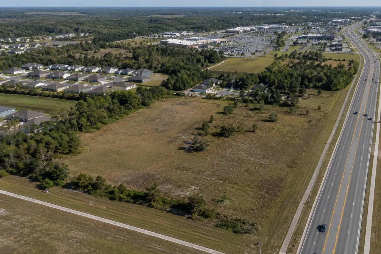Aerial view of commercial land beside a highway